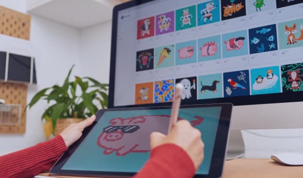 A person drawing tokenizable items on a tablet