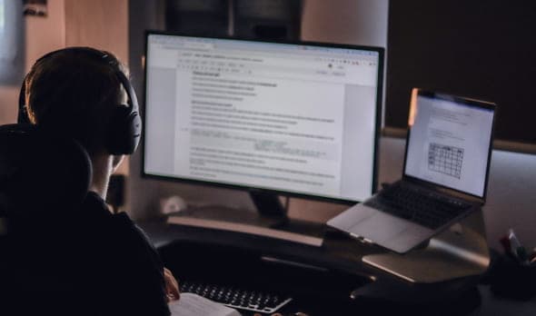 A person in a headset performing a blockchain audit