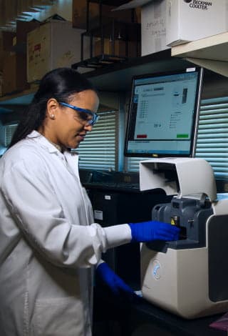 A scientist in a lab performing a research